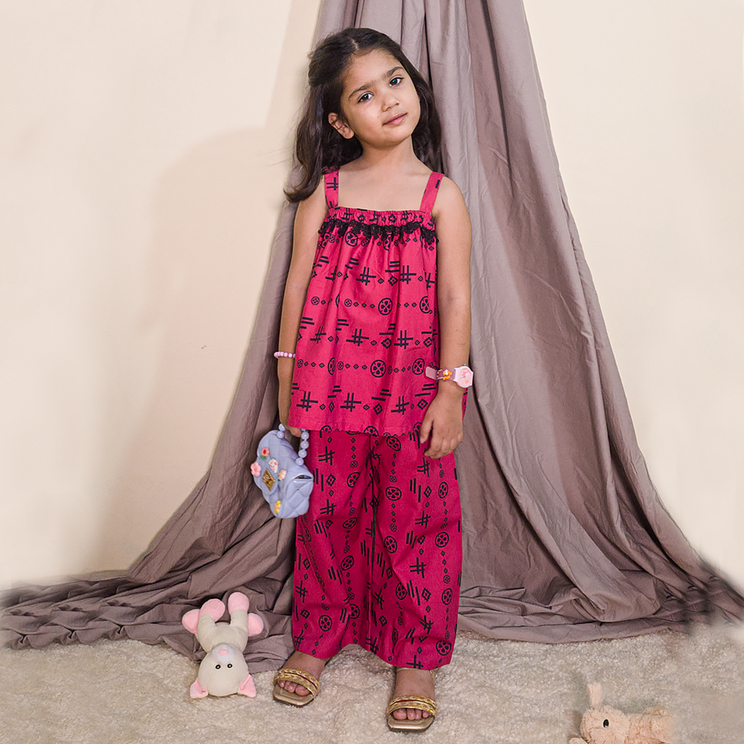 Girl wearing blush pink summer co-ord set – sleeveless top and pants, ideal for toddlers